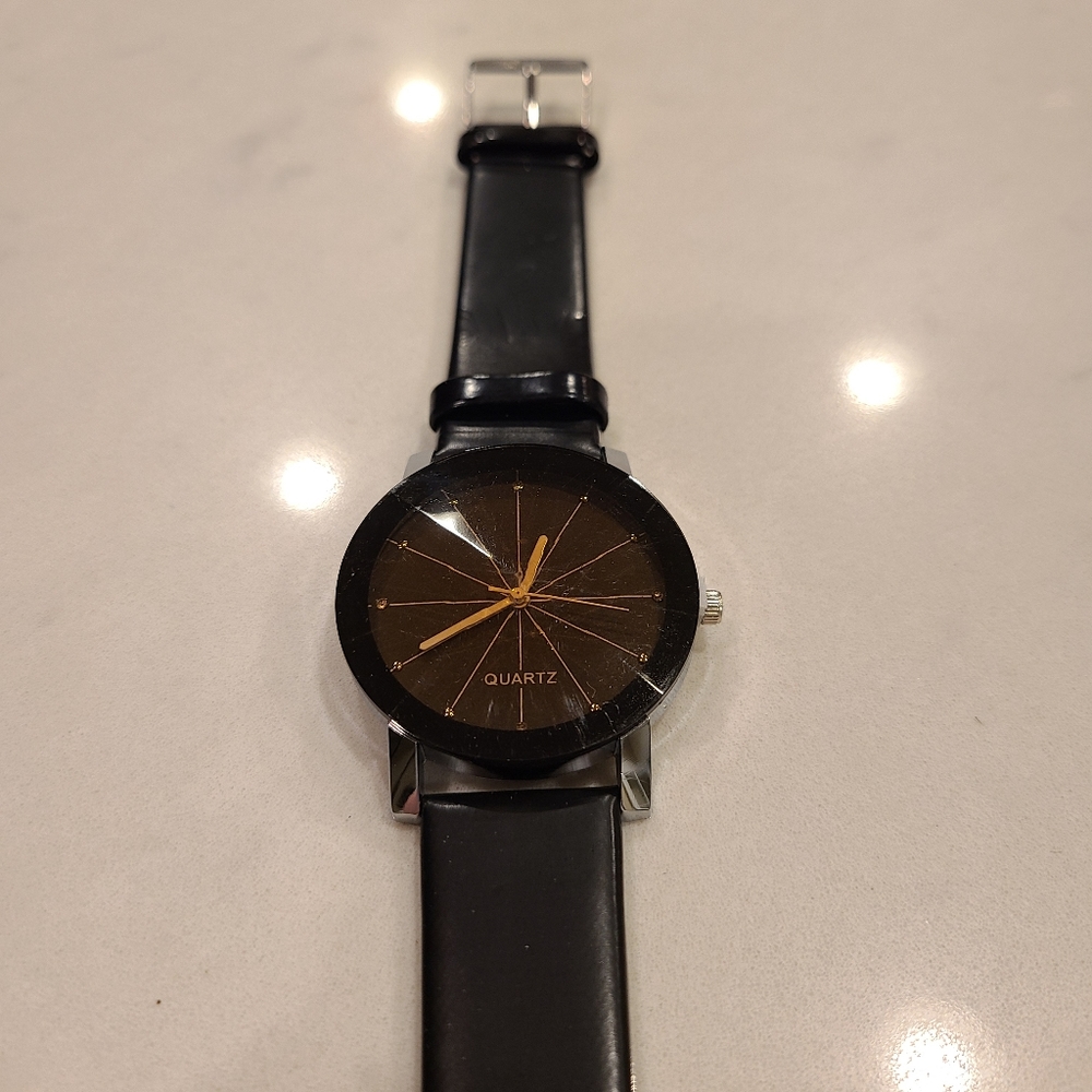 Black and gold quartz watch